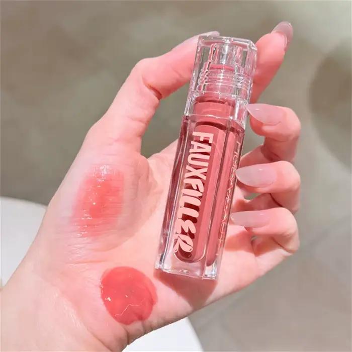 Huda Beauty Faux remplissage brillant Non collant brillant à lèvres hydratant cristal clair huile pour les lèvres repulpant hydratant teinté rouge à lèvres maquillage