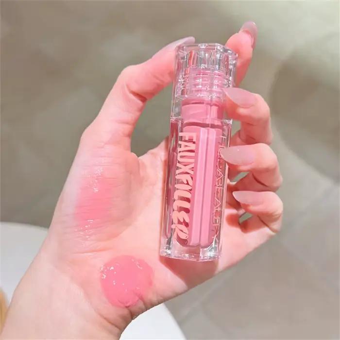 Huda Beauty Faux remplissage brillant Non collant brillant à lèvres hydratant cristal clair huile pour les lèvres repulpant hydratant teinté rouge à lèvres maquillage