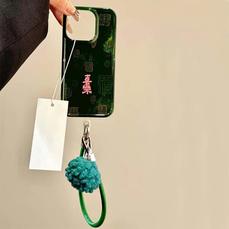 Coque de téléphone Joy à motif tourbillon, fond vert, lettrage rose, avec lanière de téléphone, pour