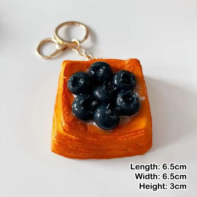 Porte-clés réaliste en pâte feuilletée en forme de fruit artificiel avec anneau doré robuste pour la